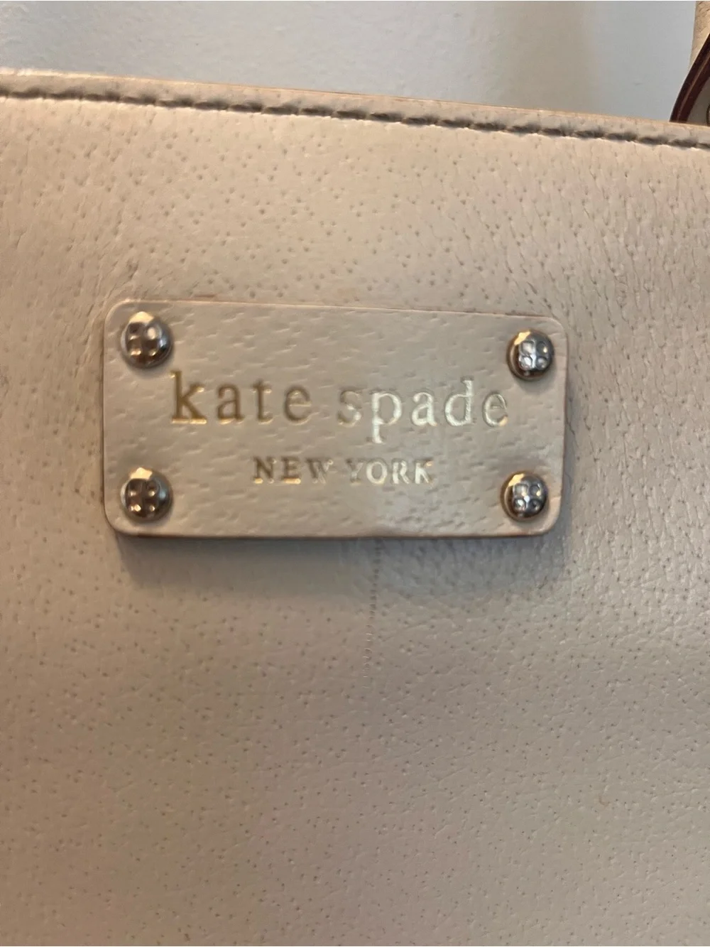 kate spade cream leather tote with gold-tone logo